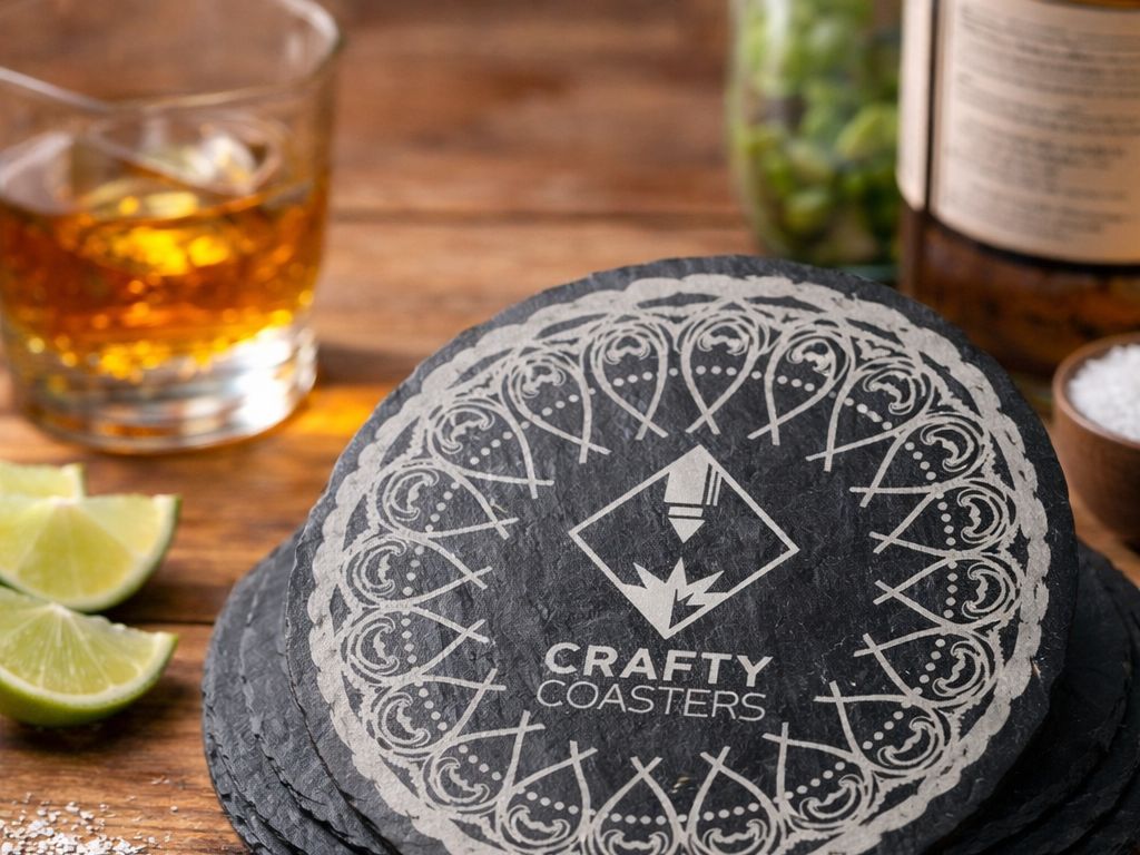 Slate coasters arranged on a rustic table